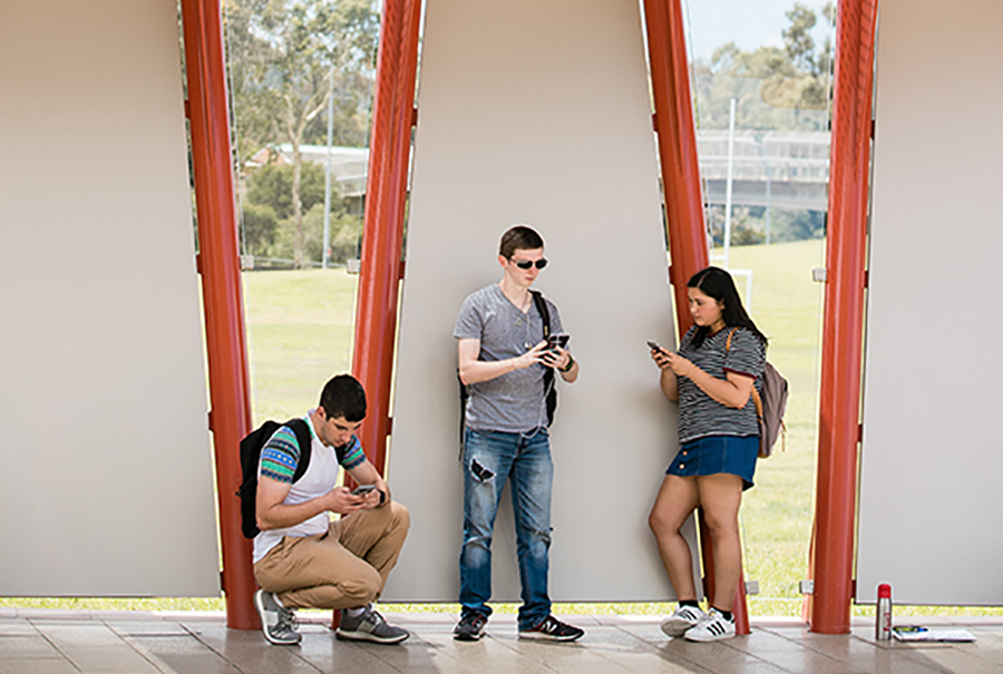 Students looking at mobile phones