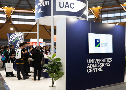 High school students at the UAC stand at a careers expo